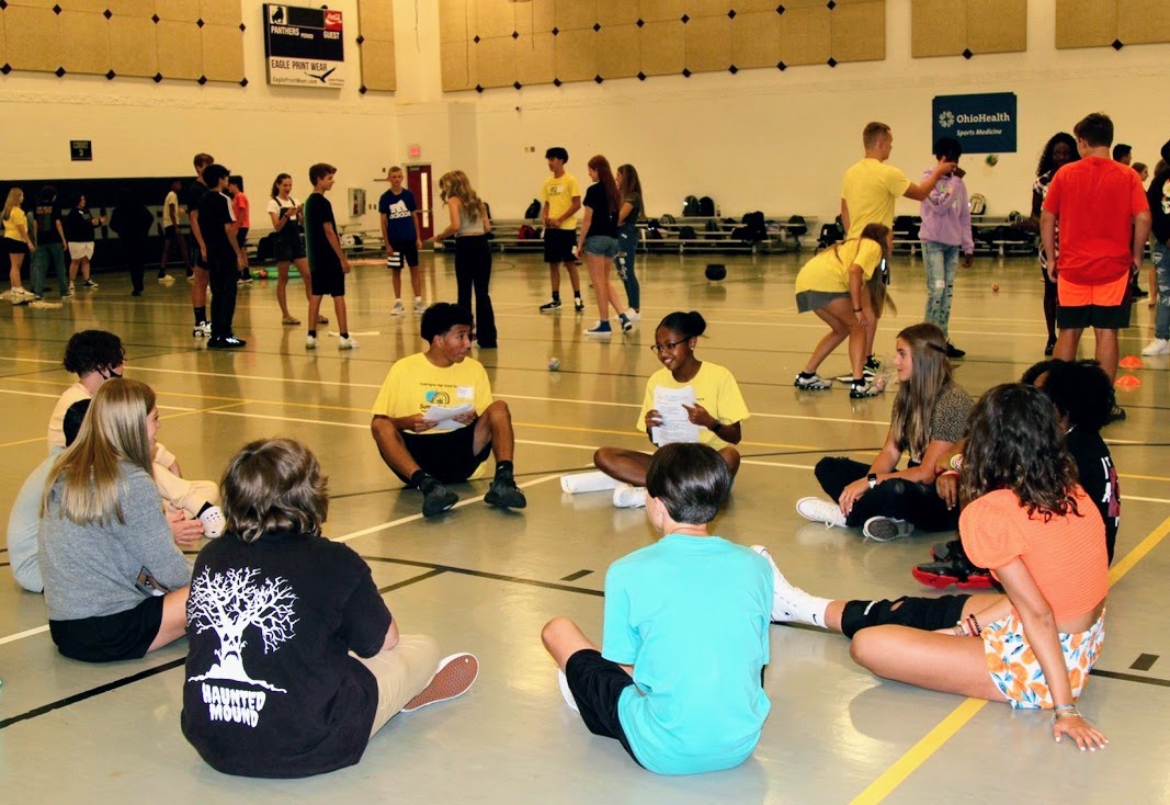 a group of students sitting in a circle