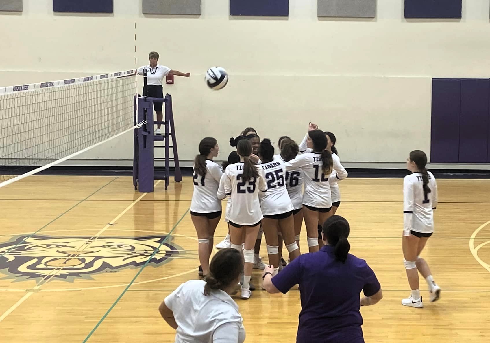 Junior High girls volleyball team on the court