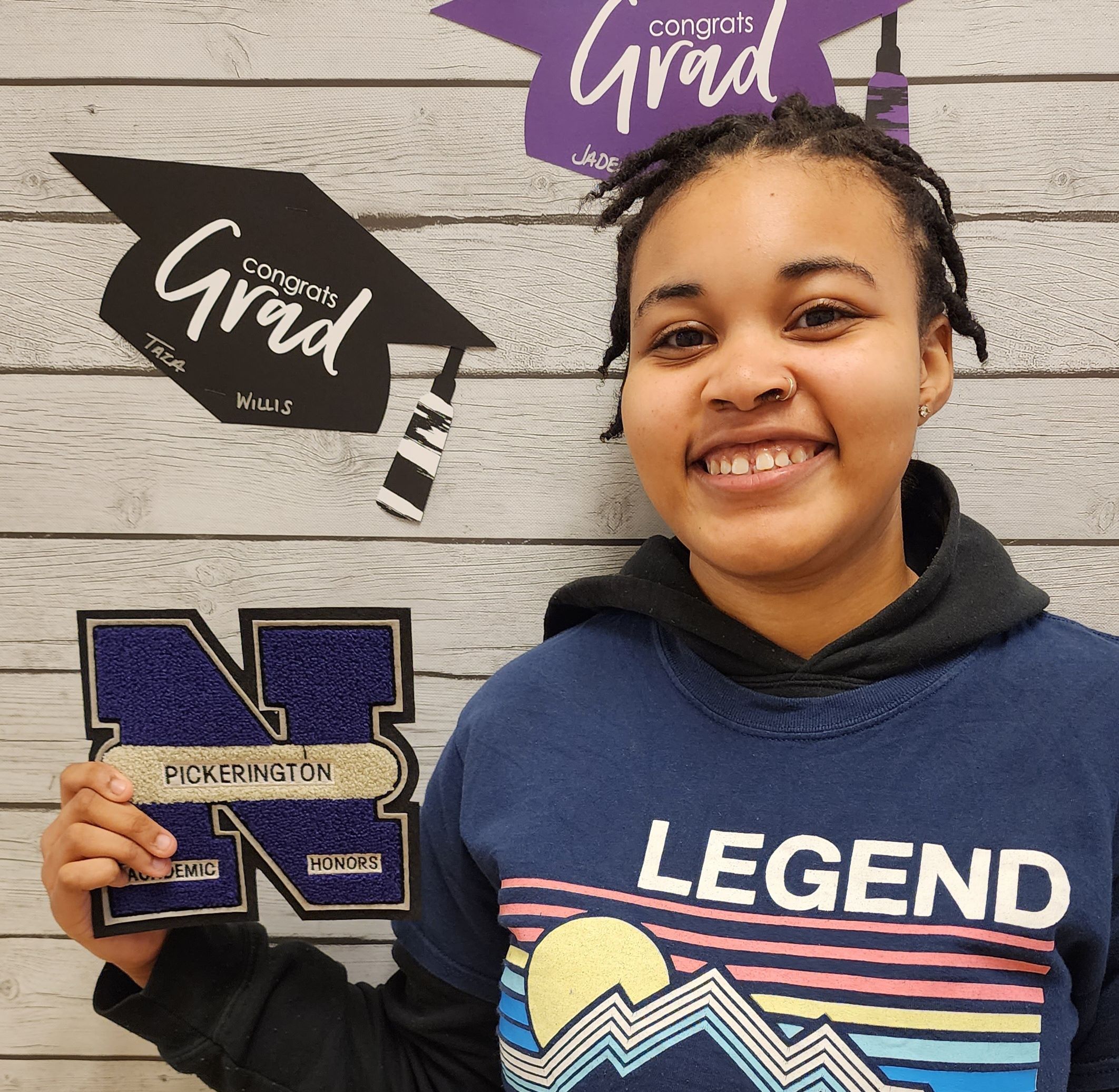 Pickerington Academy student holding an academic letter from Pickerington North