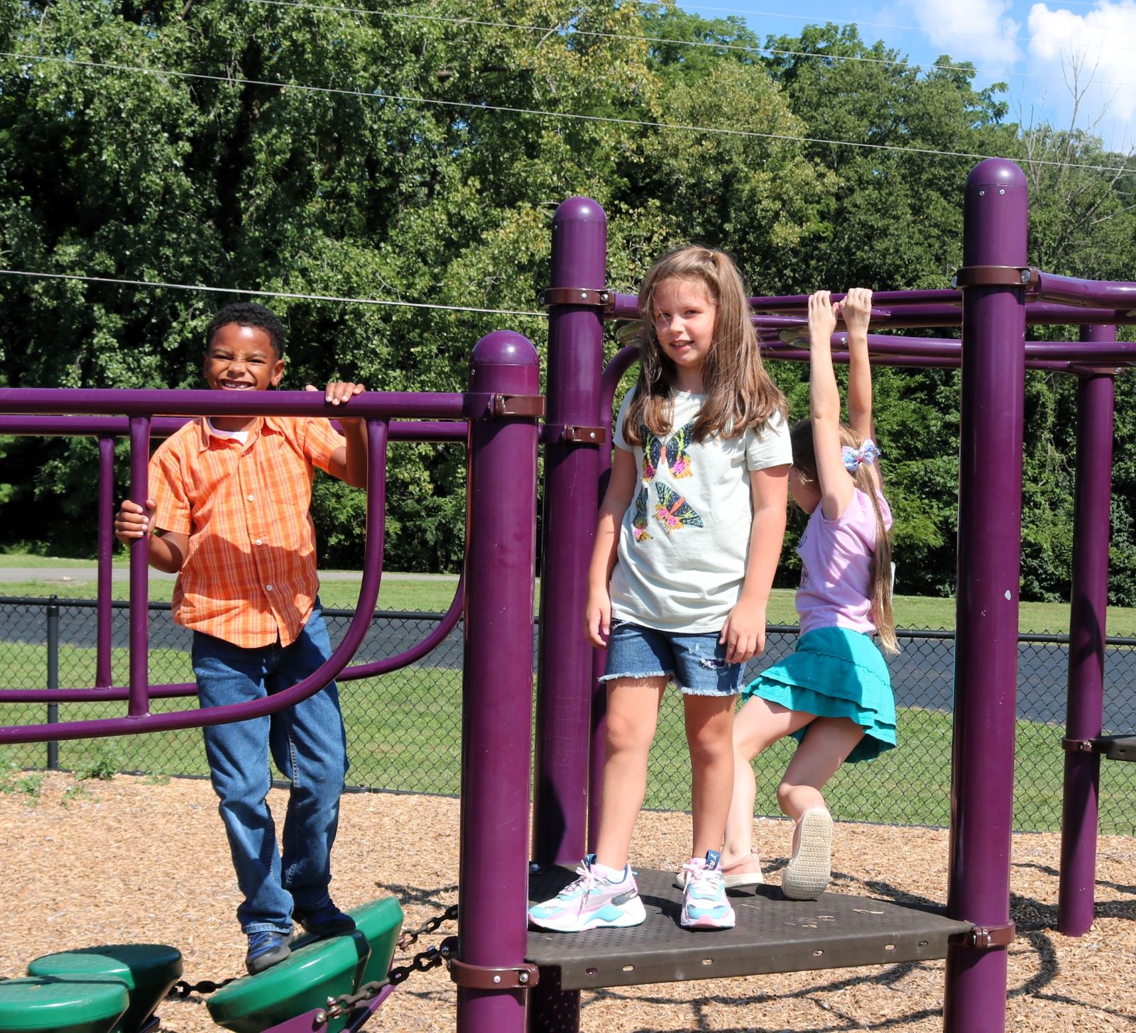 Children playing on playground equipment.