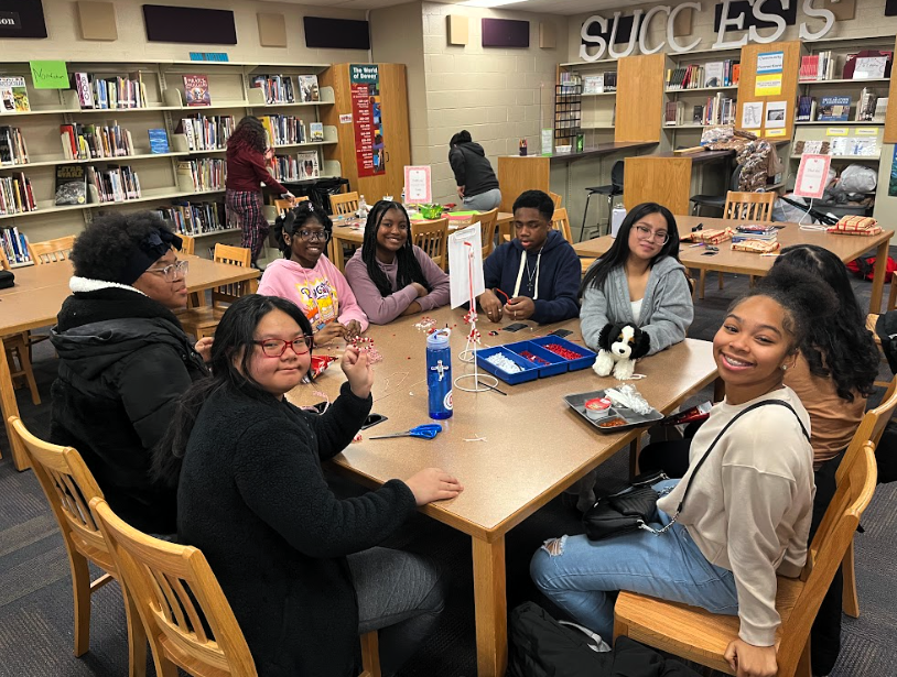group of Ridgeview STEM Junior High students enjoying a game in the media center