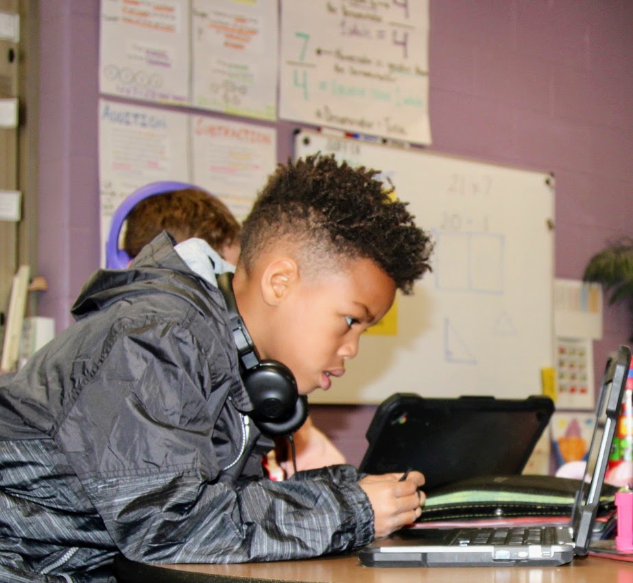 student uses a chromebook