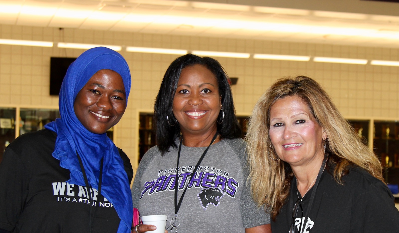 Three Pickerington Schools employees smiling 
