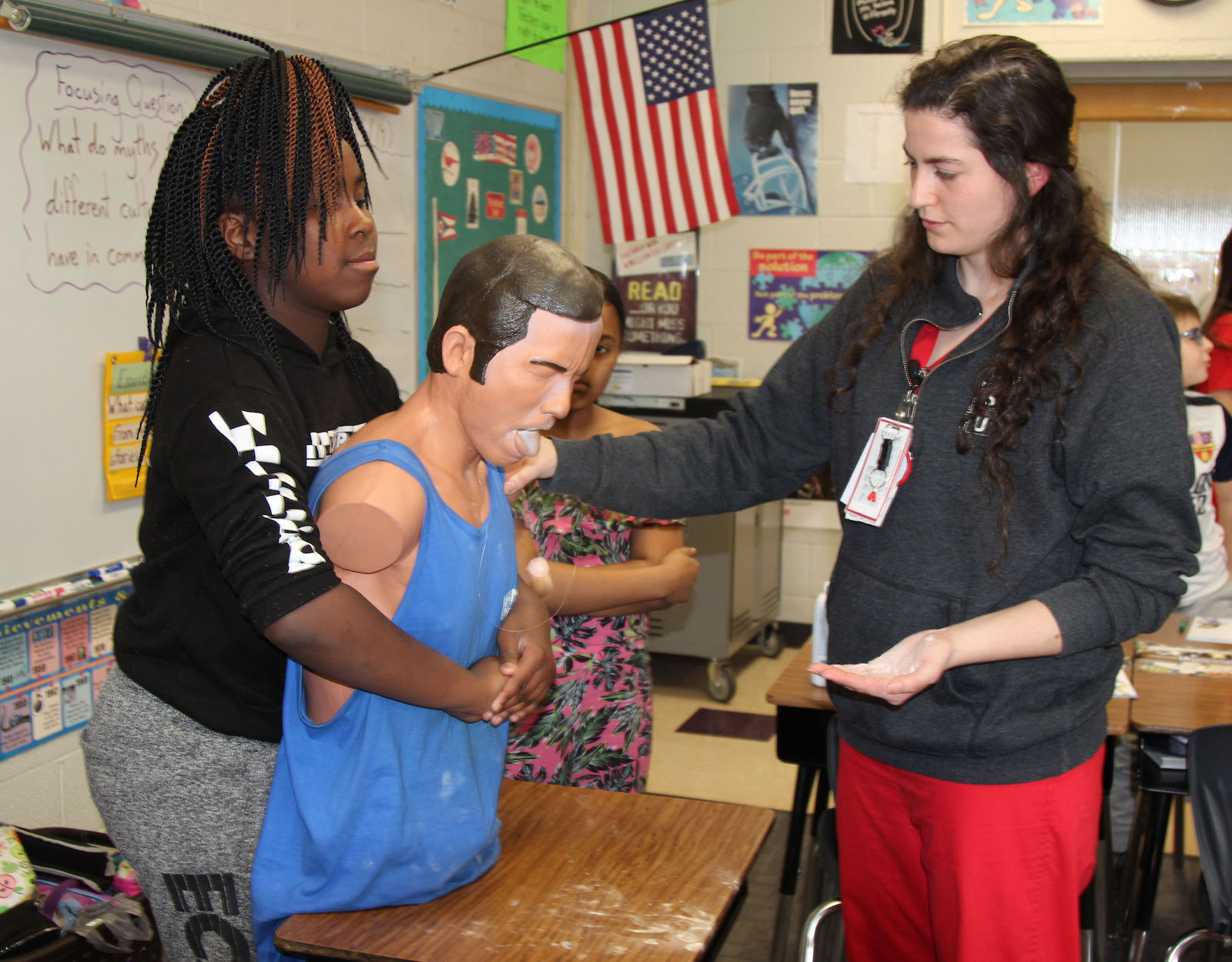health services staff person teaching students first aid