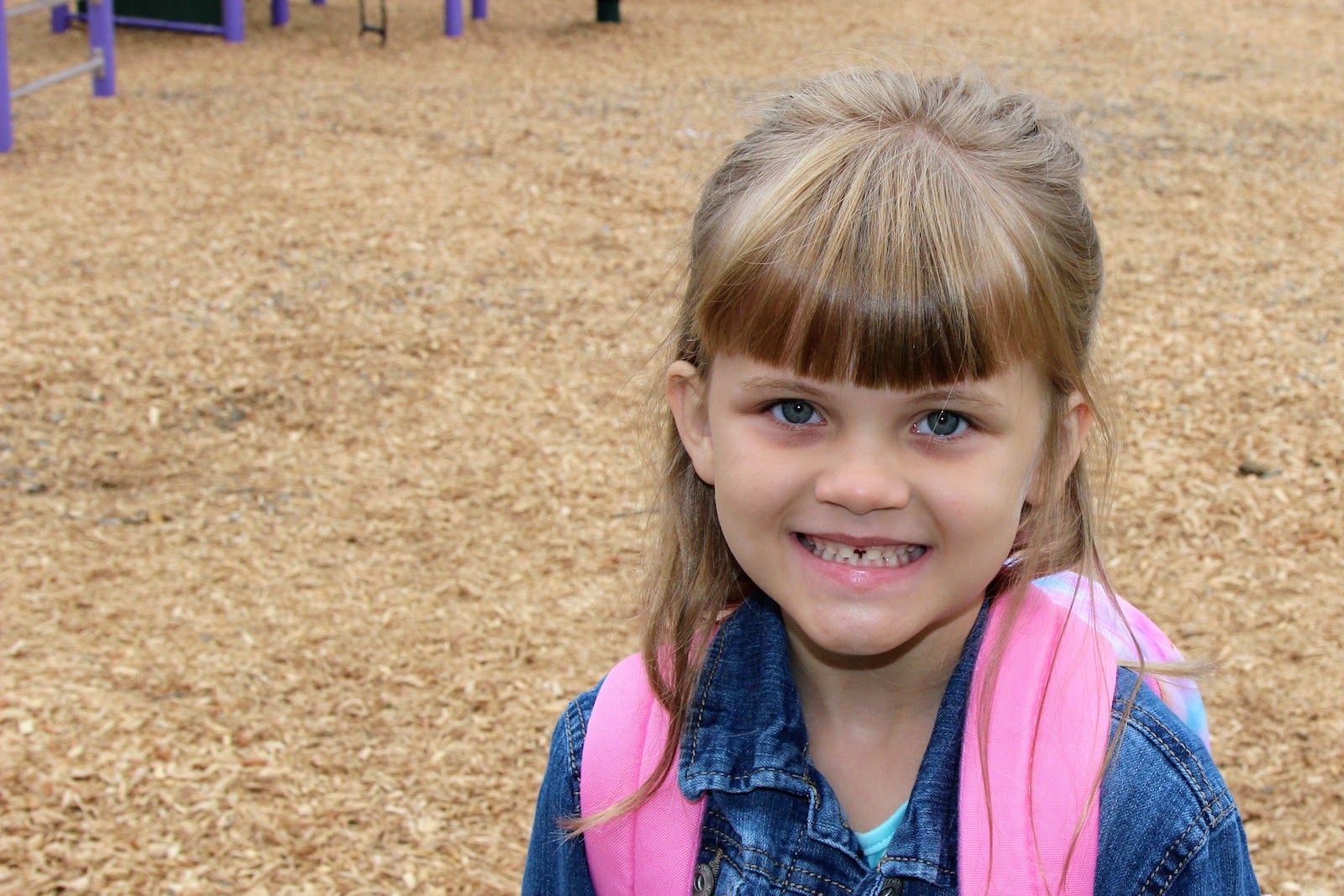 young girl smiling at camera