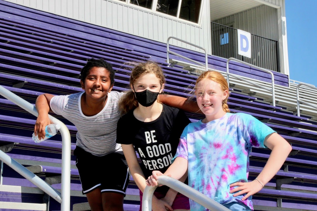 three girls at enjoying the summer sun at Tiger Stadium