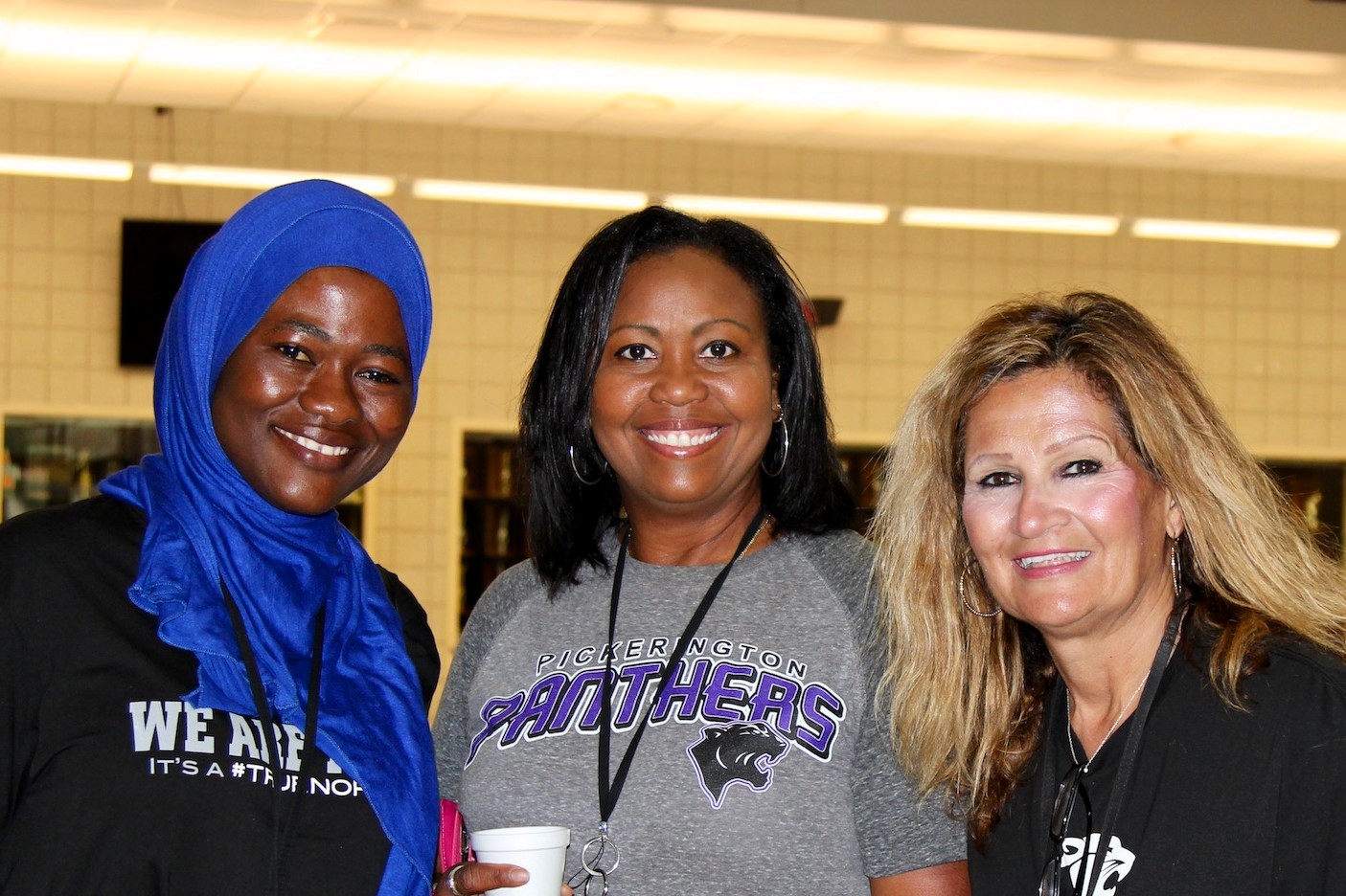 Three Pickerington Schools employees smiling at the camera