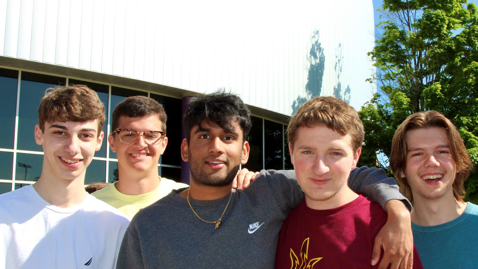 five high school boys smiling