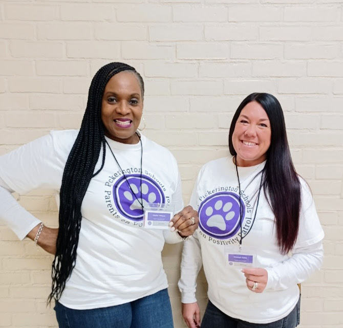 Two PoPP volunteers smiling. 