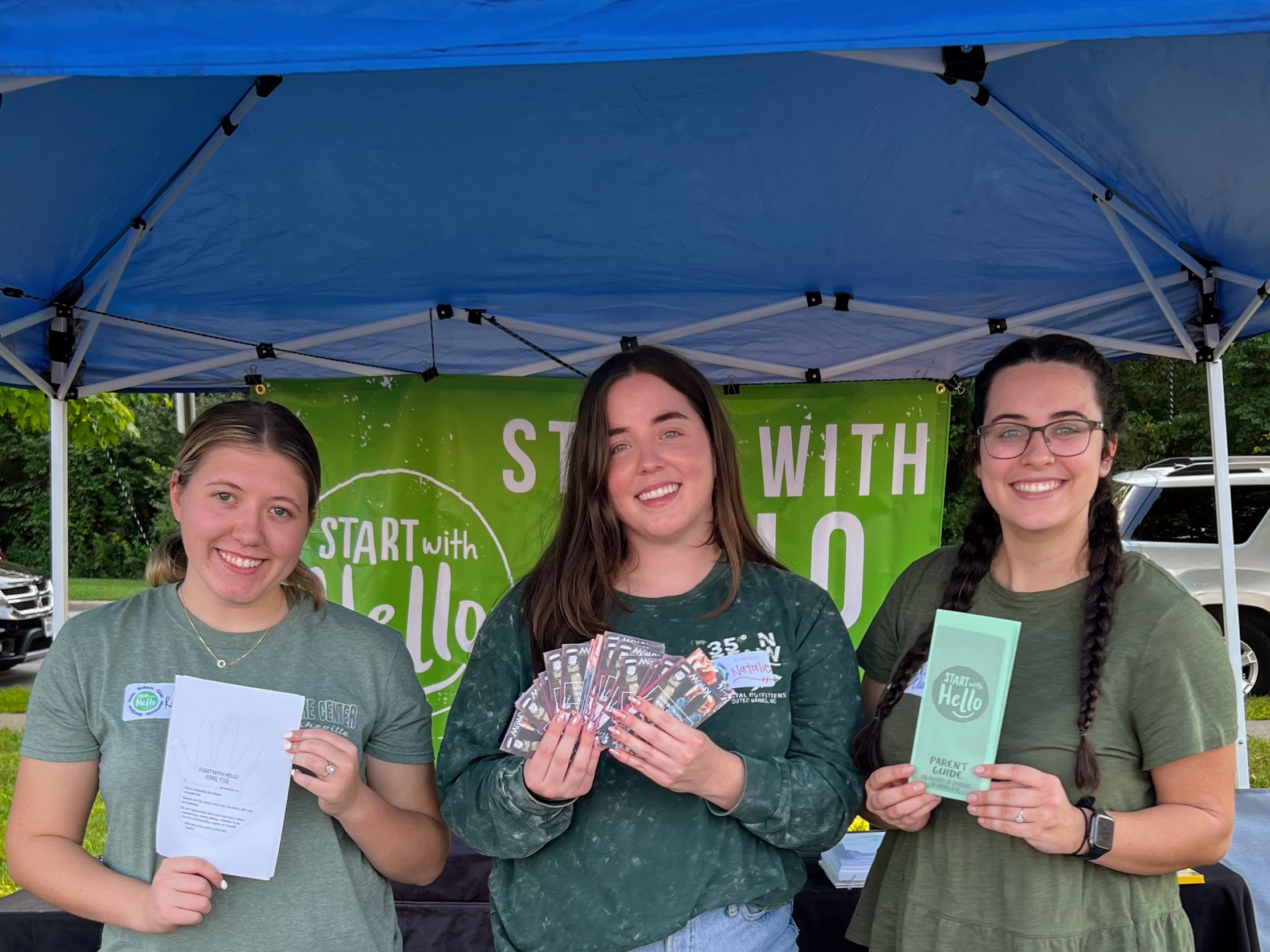 Social work interns at the Start With Hello Booth