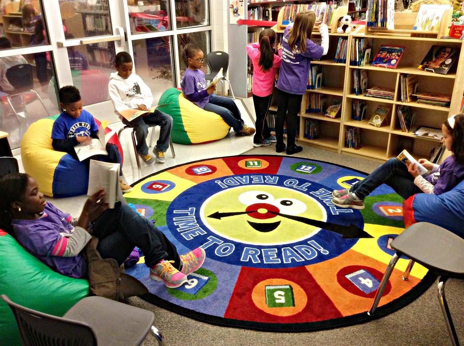 Tussing Elementary students reading books in the Media Center.