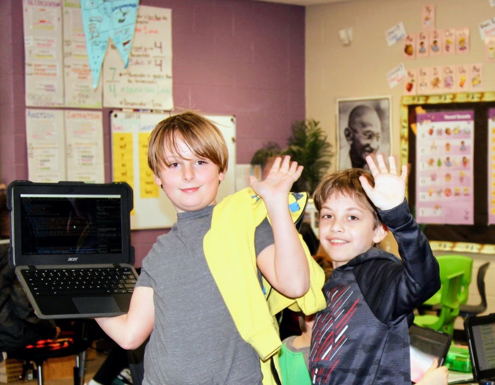 two boys waving