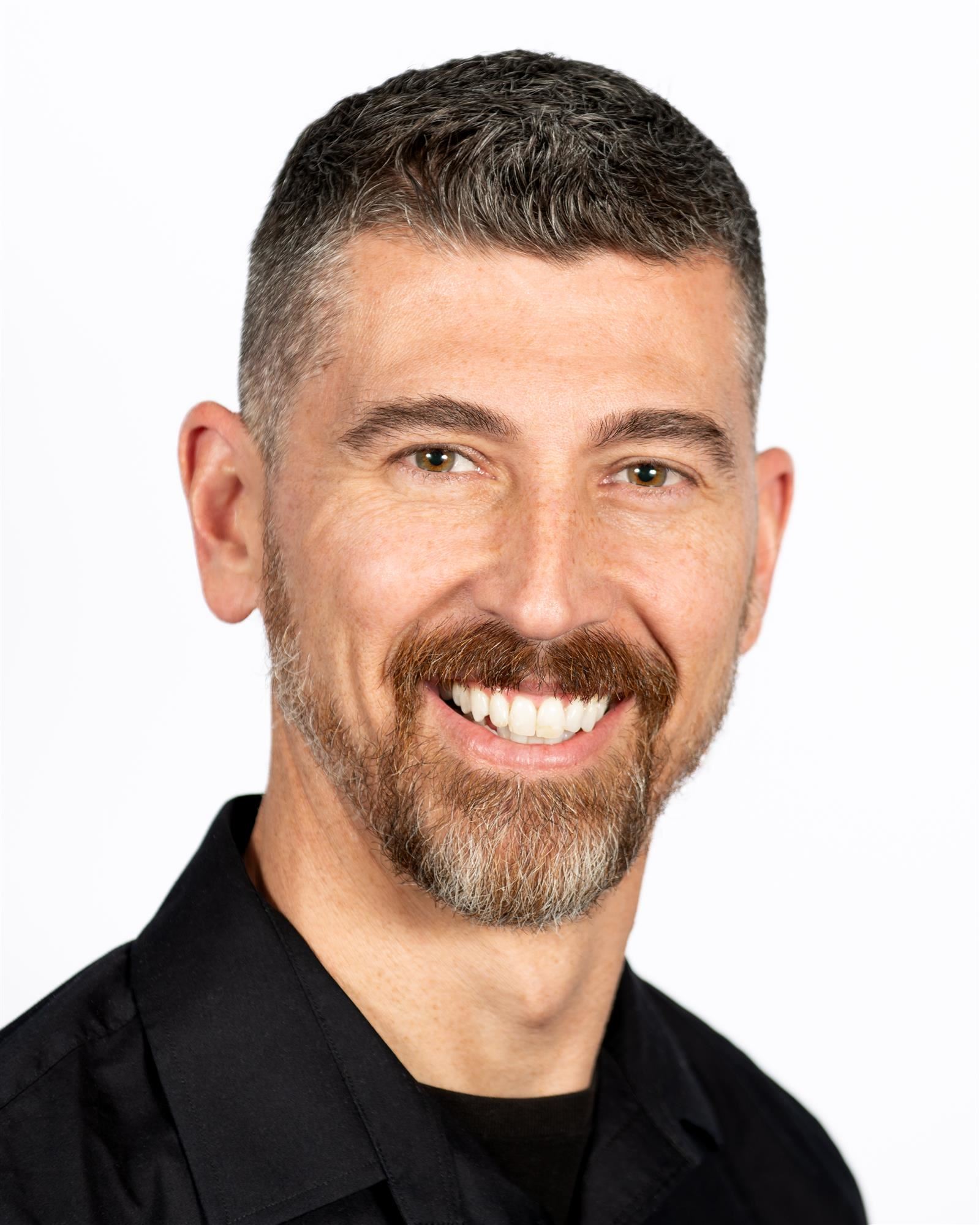  Picture of Mr. Young in the classroom, smiling
