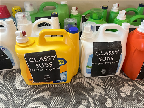 JUGS OF "CLASSY SUDS" ON THE COUNTER
