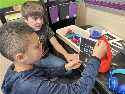 KIDS PUTTING "CLASSY SUDS" LABELS ON THE JUGS
