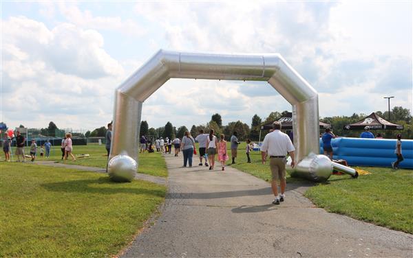 An inflatable arch marks the entrance to the Family & Community Festival's Children's Area.