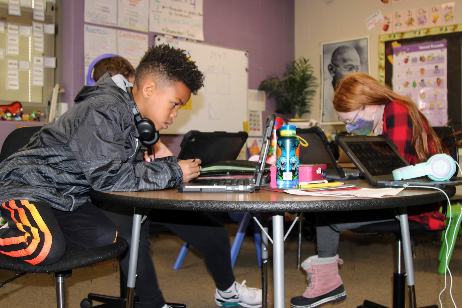 two kids working on their chromebooks